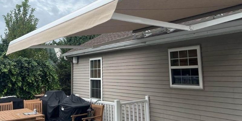 Patio with outdoor furniture and a retractable awning.