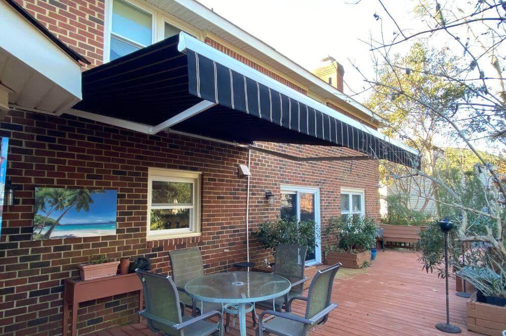 Patio with outdoor furniture under a retractable
